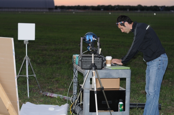 Joseph Meola of Air Force Research Labs conducting measurements on laser light bounced back from various samples placed 1.6 kilometers