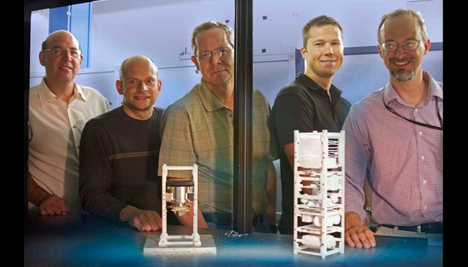 Brian Bauman, Vincent Riot, Darrell Carter, Lance Simms and Wim De Vries have developed and tested land-based mini-satellites that eventually will be used in space to help control traffic in space
