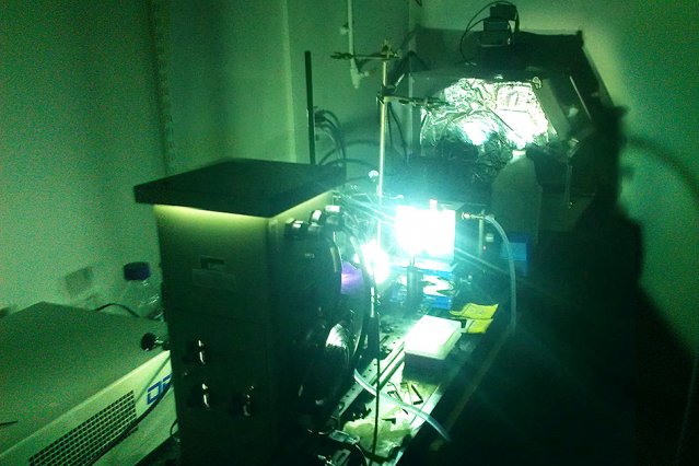 A powerful arc lamp is used to simulate sunlight on a sample of photoswitchable molecules, driving structural changes at the molecular level