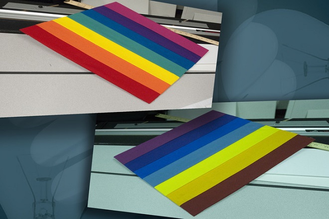 A rainbow pattern as seen under a long-linear, fluorescent light source common for commercial interiors (top). And, the same rainbow pattern as it appears under a non-commercial, fluorescent light source (bottom). The color differences result from the use of different phosphors in the lights glass tubing