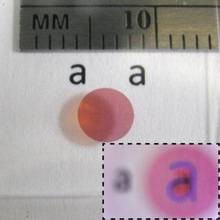 Photo of a high contrast transmitarray lens designed for red light