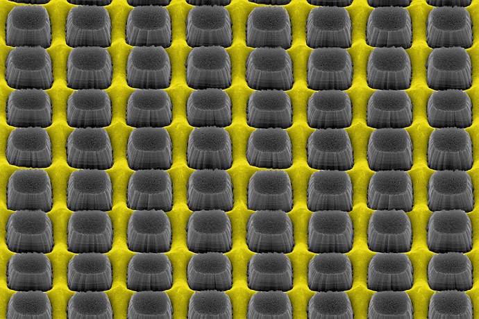 An array of nanopillars etched by thin layer of grate-patterned metal creates a nonreflective yet conductive surface that could improve electronic device performance