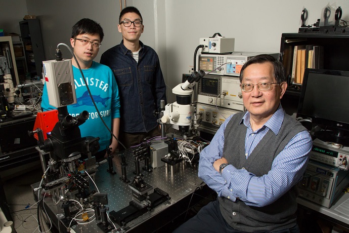 Graduate students Junyi Wu and Curtis Wang and professor Milton Feng