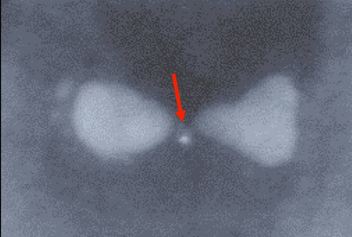 A bowtie-shaped nanoparticle made of silver with a trapped semiconductor quantum dot