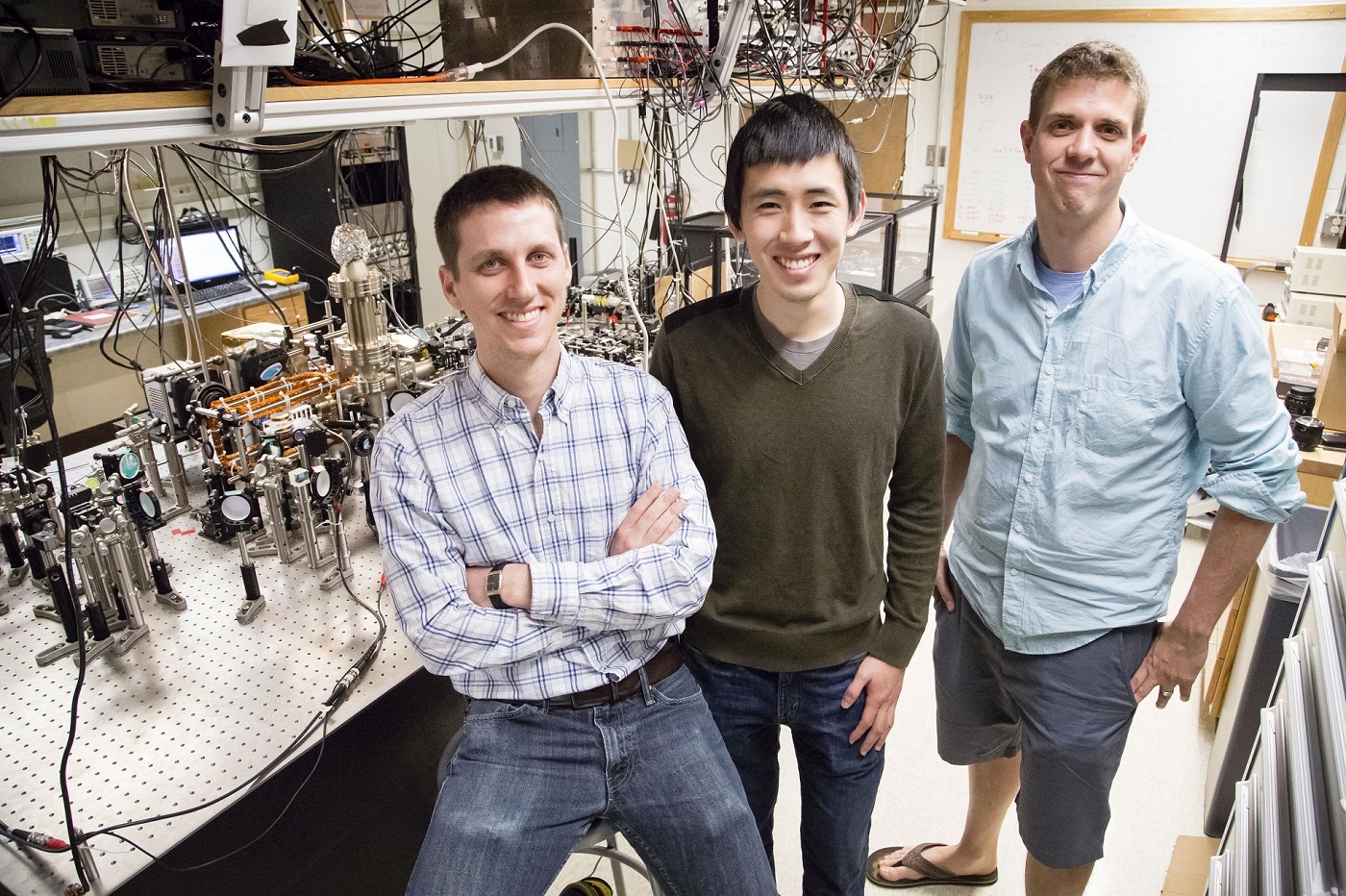 Graduate students Eric Meier and Fangzhao Alex An with Bryce Gadway in Loomis Laboratory