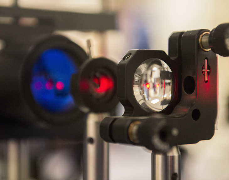 An infrared laser beam is going into the receiver of the signaling system