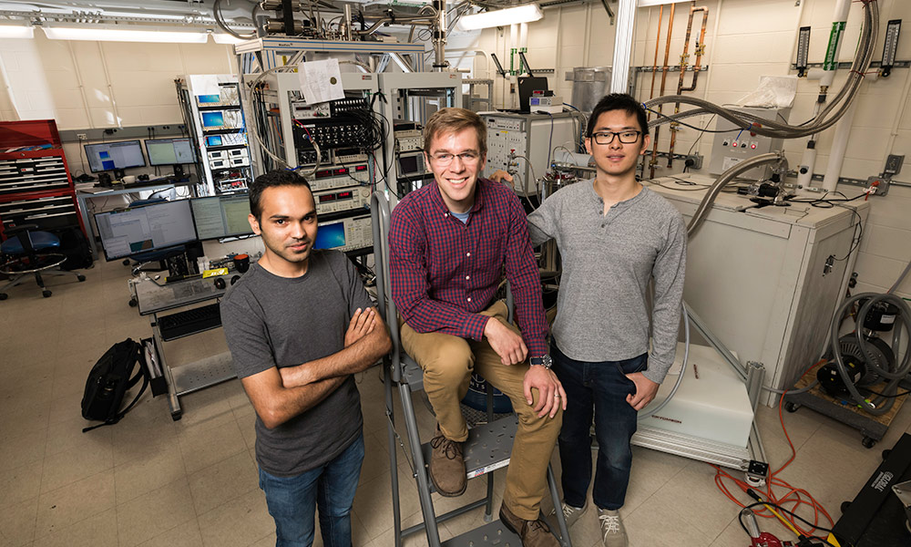 John Nichol and PhD students Yadav Kandel, left, and Haifeng Qiao, right, demonstrated a way to manipulate electrons and transmit information quantum-mechanically, bringing scientists one step closer to creating a fully functional quantum computer
