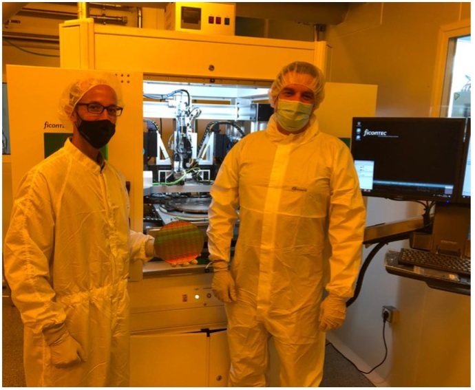 VLC Photonics’ CTO David Domenech and ficonTEC Production Engineer Tim Kluge after installation of the new WLT system.