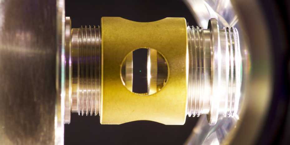 A glass sphere a hundred nanometres in diameter is made to hover by a tightly focused laser beam