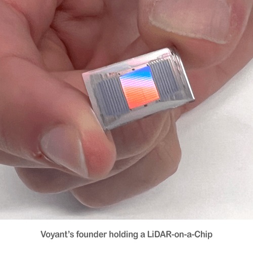 Voyant's founder holding a LiDAR-on-a-Chip