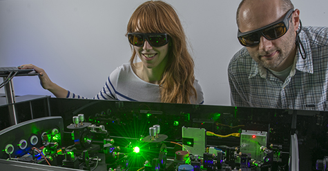 Graduate student Michelle Harris and research scientist Darek Niedzwiedzki in PARC’s Ultrafast Laser Facility