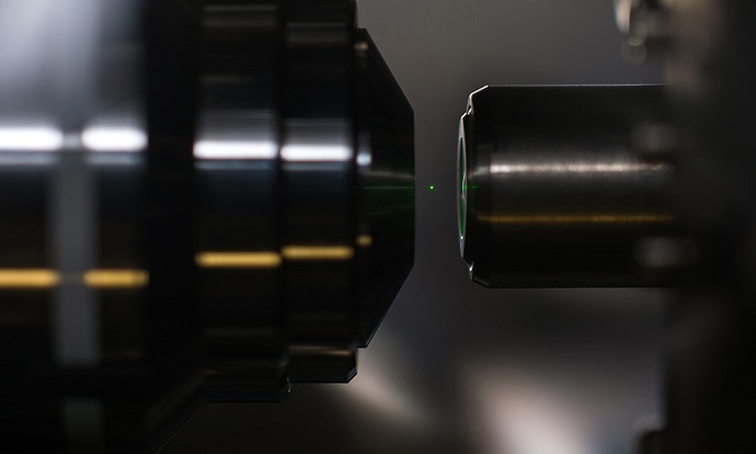 A nanodiamond containing hundreds of nitrogen vacancies glows while levitated by a laser during an experiment in Nick Vamivakas' lab at the University of Rochester