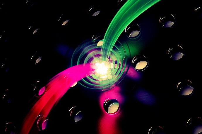 Artistic graphic depicting photon-spin interactions in a quantum dot