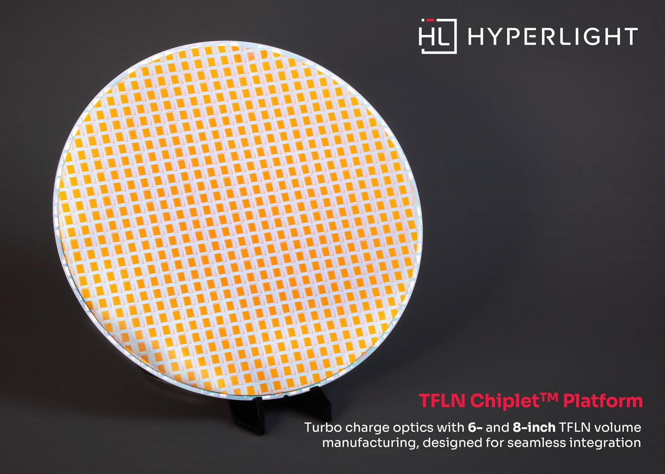An 8-inch TFLN wafer produced through HyperLight’s TFLN Chiplet™ platform, holding over 500 1.6T DR8 transmitter PICs. class=