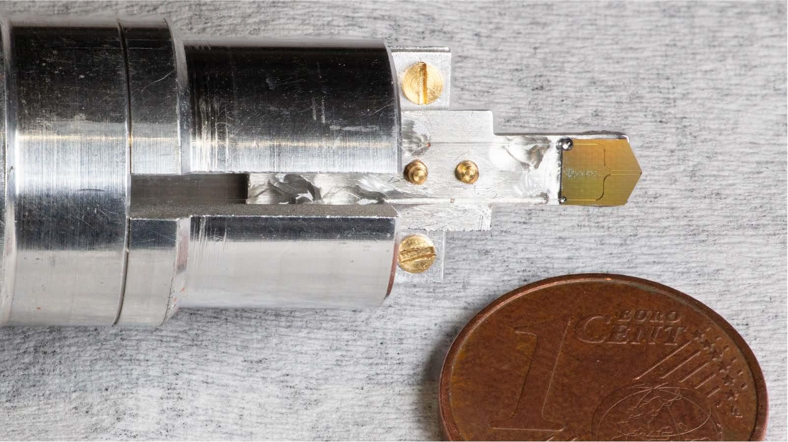 Photograph of the photonic chip mounted on a custom holder. Credit: Yang et al 2025.