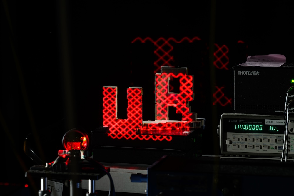 Researchers demonstrate how their laser could be used to drive a LiDAR system on a spinning disc and identify the letters U and R made out of LEGO blocks