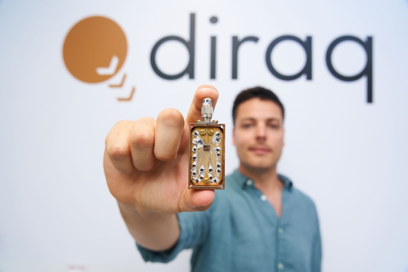 Diraq engineer holding chip